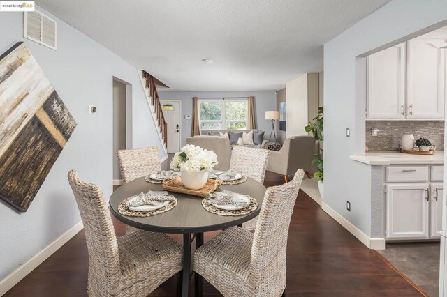 dining room with dark wood-type flooring