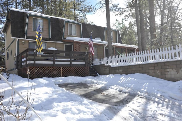 view of snow covered house