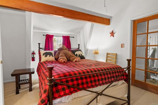 carpeted bedroom with lofted ceiling with beams