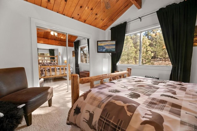 carpeted bedroom featuring wood ceiling, lofted ceiling with beams, and a closet