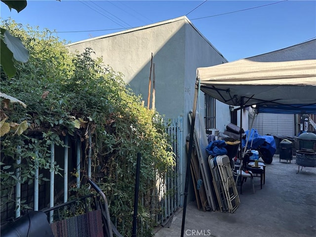 view of side of property with a patio area