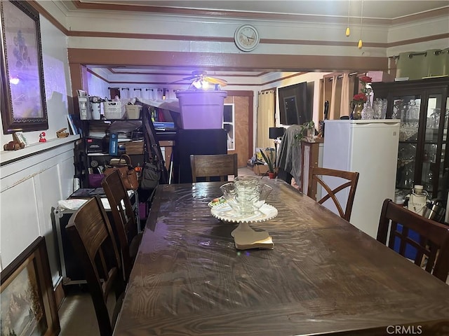 dining room featuring crown molding