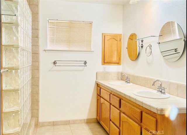 bathroom with tile patterned floors and vanity