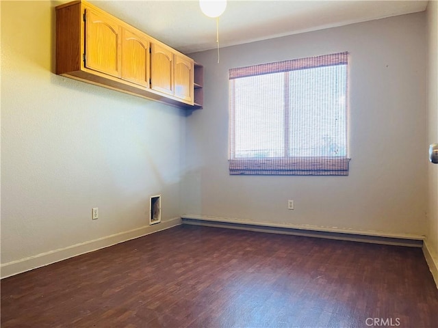 unfurnished room featuring dark hardwood / wood-style floors