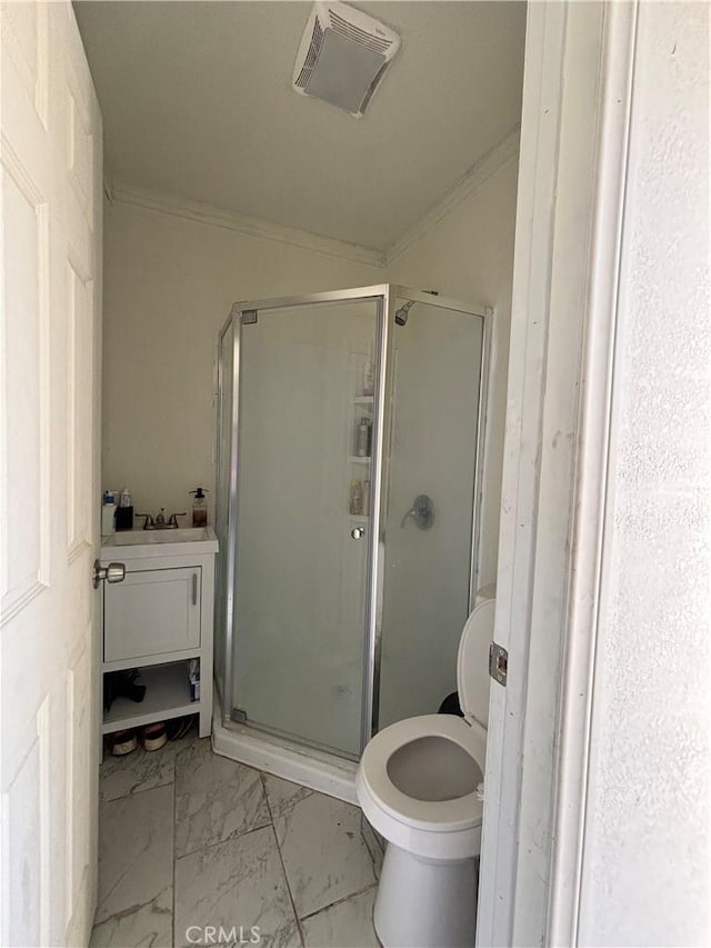 bathroom with an enclosed shower, toilet, and crown molding