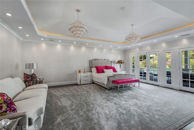 bedroom featuring a raised ceiling, french doors, access to outside, and an inviting chandelier