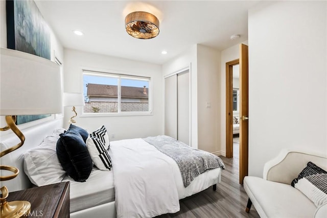 bedroom with a closet and wood-type flooring