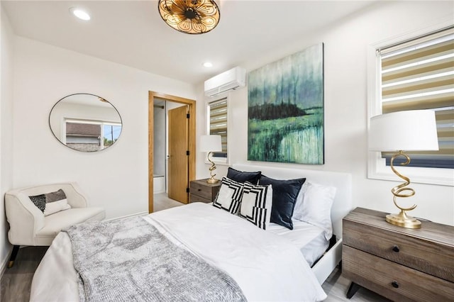 bedroom featuring a wall unit AC