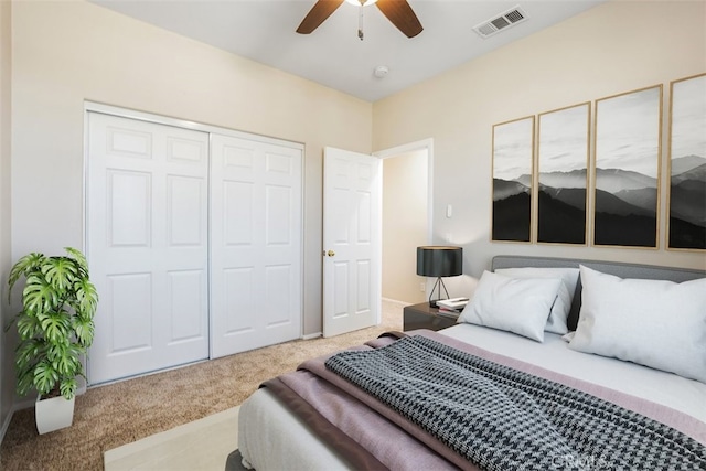 bedroom featuring ceiling fan, carpet flooring, and a closet