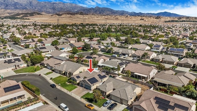 birds eye view of property with a mountain view