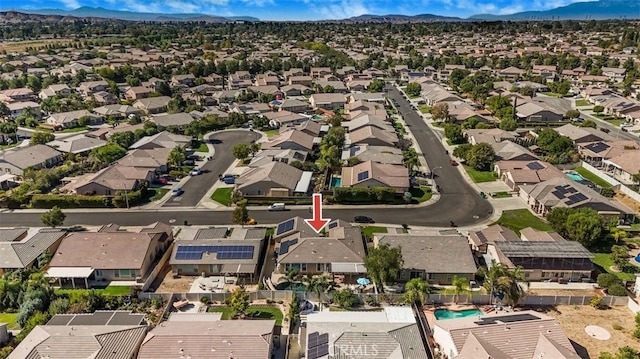 birds eye view of property featuring a mountain view