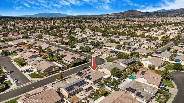 birds eye view of property featuring a mountain view