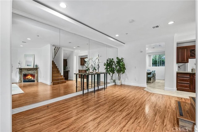 unfurnished living room featuring light hardwood / wood-style flooring