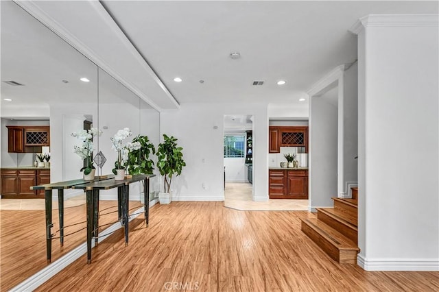 hallway with light hardwood / wood-style flooring