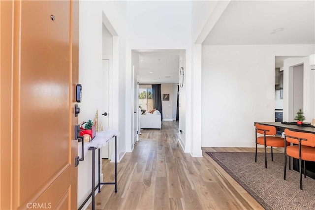 hallway featuring light hardwood / wood-style flooring