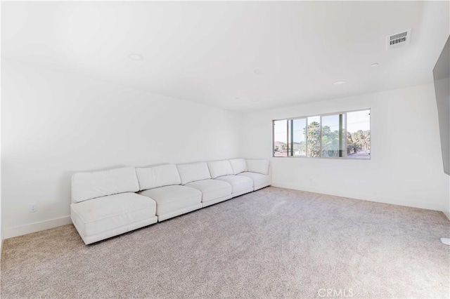 unfurnished living room with light carpet