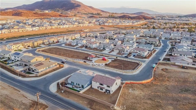 birds eye view of property featuring a mountain view