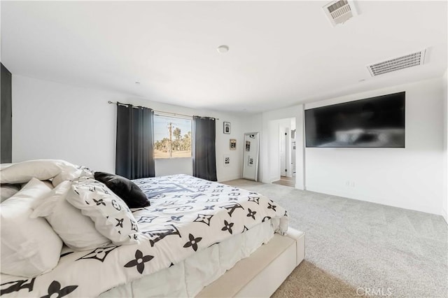 bedroom with light colored carpet