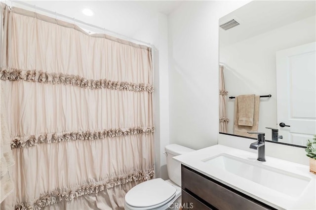 full bathroom with toilet, vanity, and shower / bathtub combination with curtain