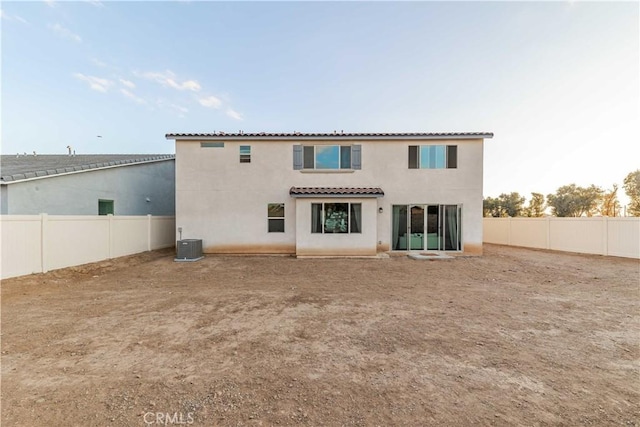 back of property featuring cooling unit