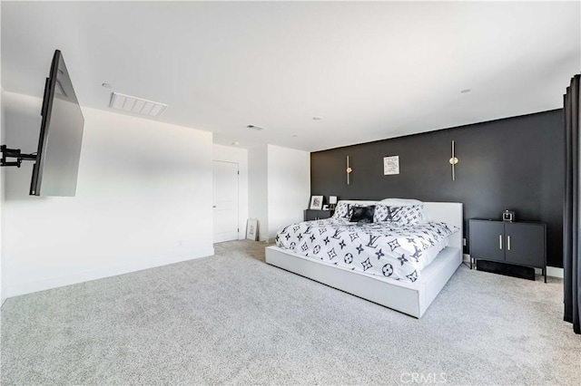 bedroom with light colored carpet