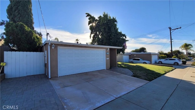 garage featuring a lawn