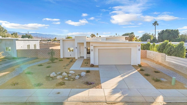 view of front of house with a mountain view and a garage