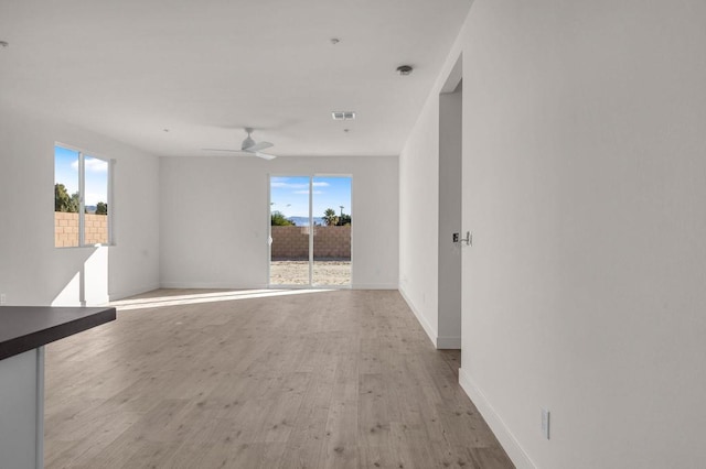 spare room with ceiling fan and light hardwood / wood-style flooring