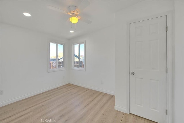 unfurnished room featuring ceiling fan and light hardwood / wood-style flooring