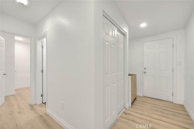 hall with light hardwood / wood-style floors