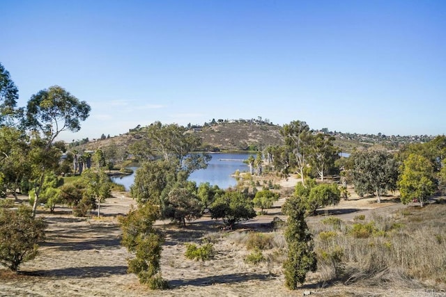 exterior space with a water and mountain view and a rural view