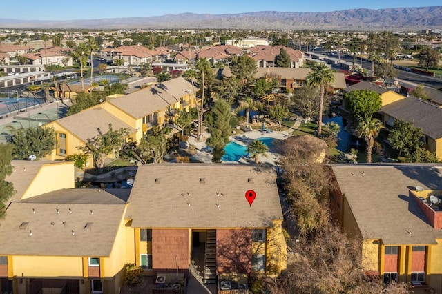 birds eye view of property with a mountain view