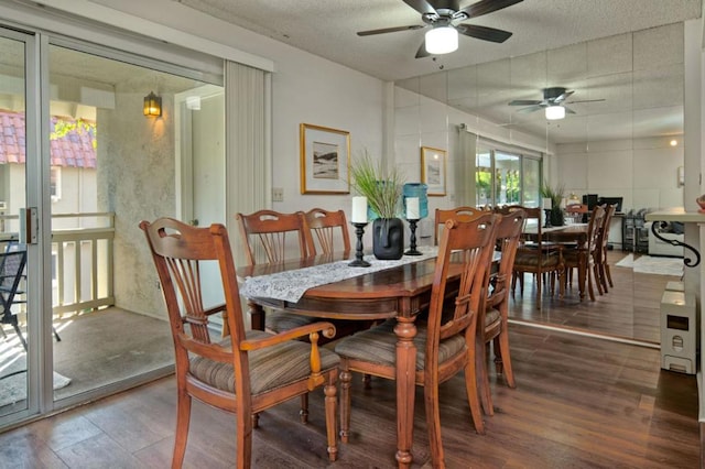 dining room with ceiling fan, a textured ceiling, and dark hardwood / wood-style flooring