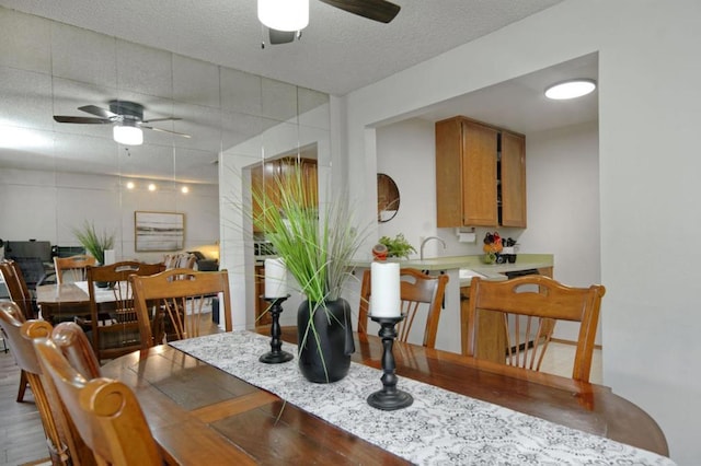 dining space with a textured ceiling