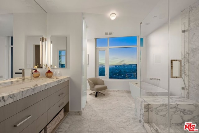 bathroom with vanity and independent shower and bath