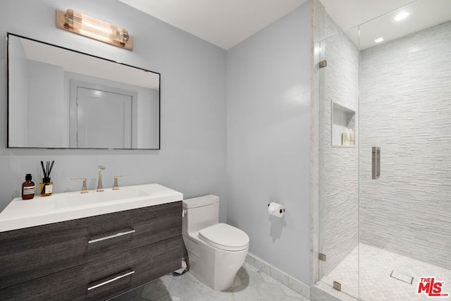 bathroom with an enclosed shower, vanity, and toilet