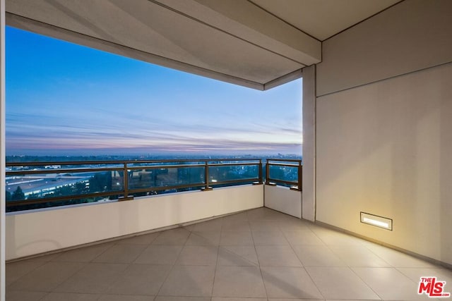 view of balcony at dusk