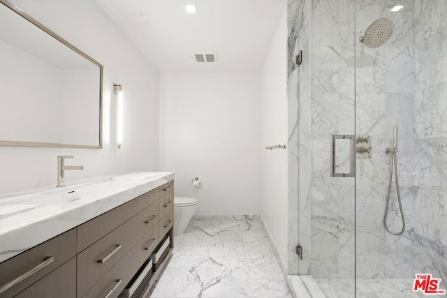 bathroom with toilet, vanity, and an enclosed shower