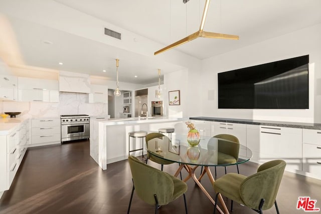 dining space with dark hardwood / wood-style flooring