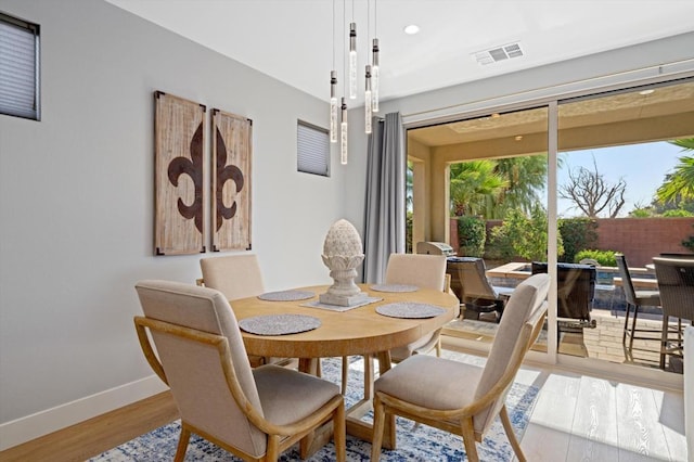 dining space with light wood-type flooring