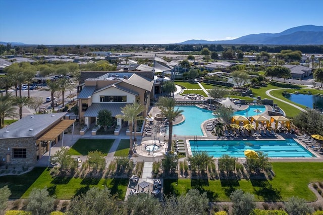 birds eye view of property with a mountain view