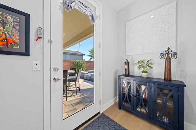 doorway to outside with light hardwood / wood-style floors