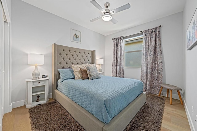 bedroom with ceiling fan and light hardwood / wood-style floors