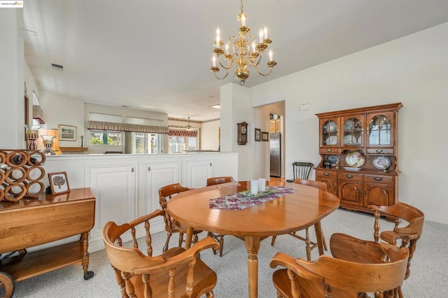 dining space with a notable chandelier