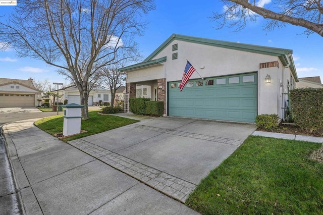 view of front facade with a front yard and a garage