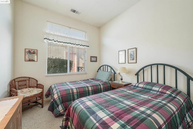 bedroom with light carpet