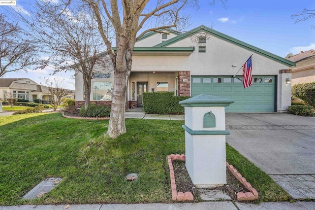 view of front of home featuring a garage and a front yard