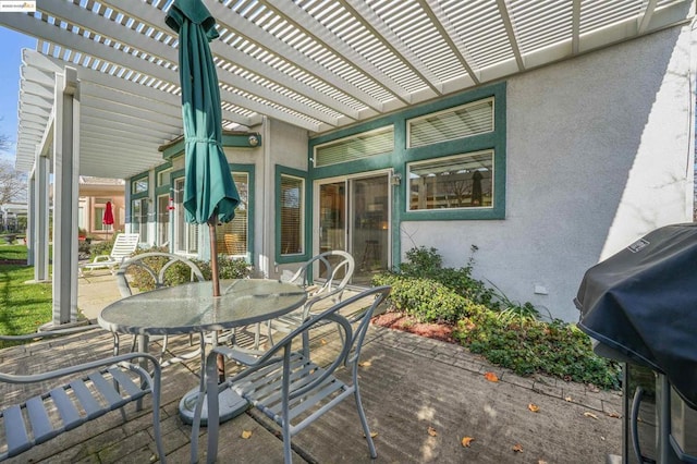 view of patio featuring a pergola and a grill