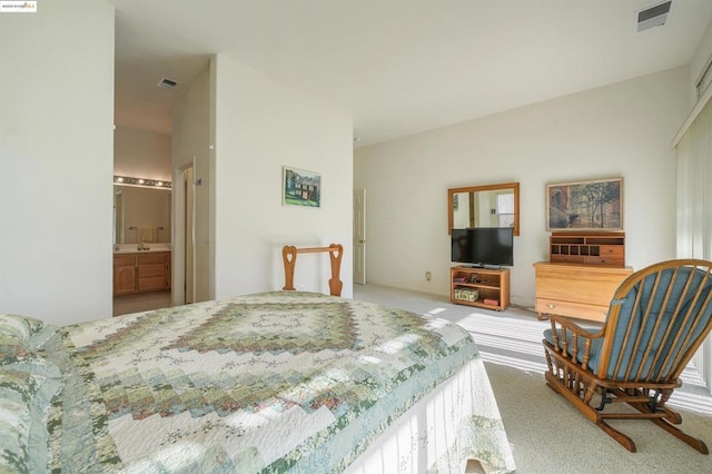 carpeted bedroom featuring connected bathroom