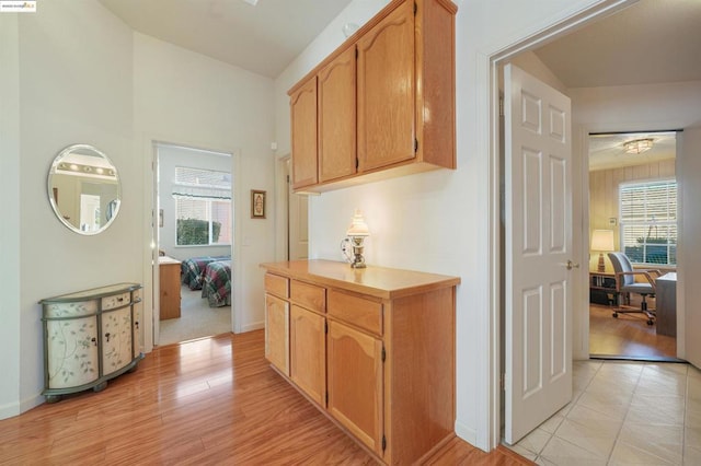 corridor with light hardwood / wood-style flooring